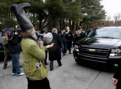 Vermin Supreme wearing a boot on his head
